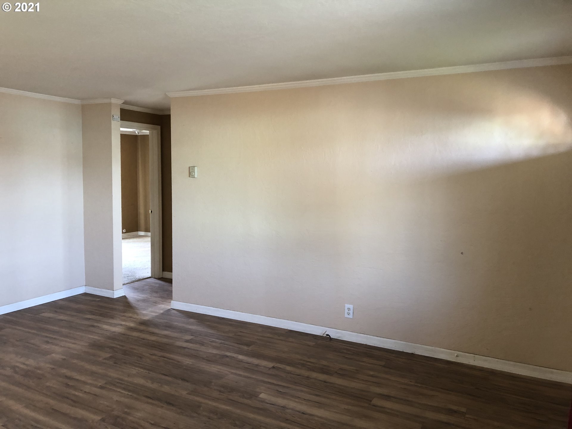 415 38th Street Springfield, OR 97478 - Photo 3 of 17 a view of an empty room with wooden floor