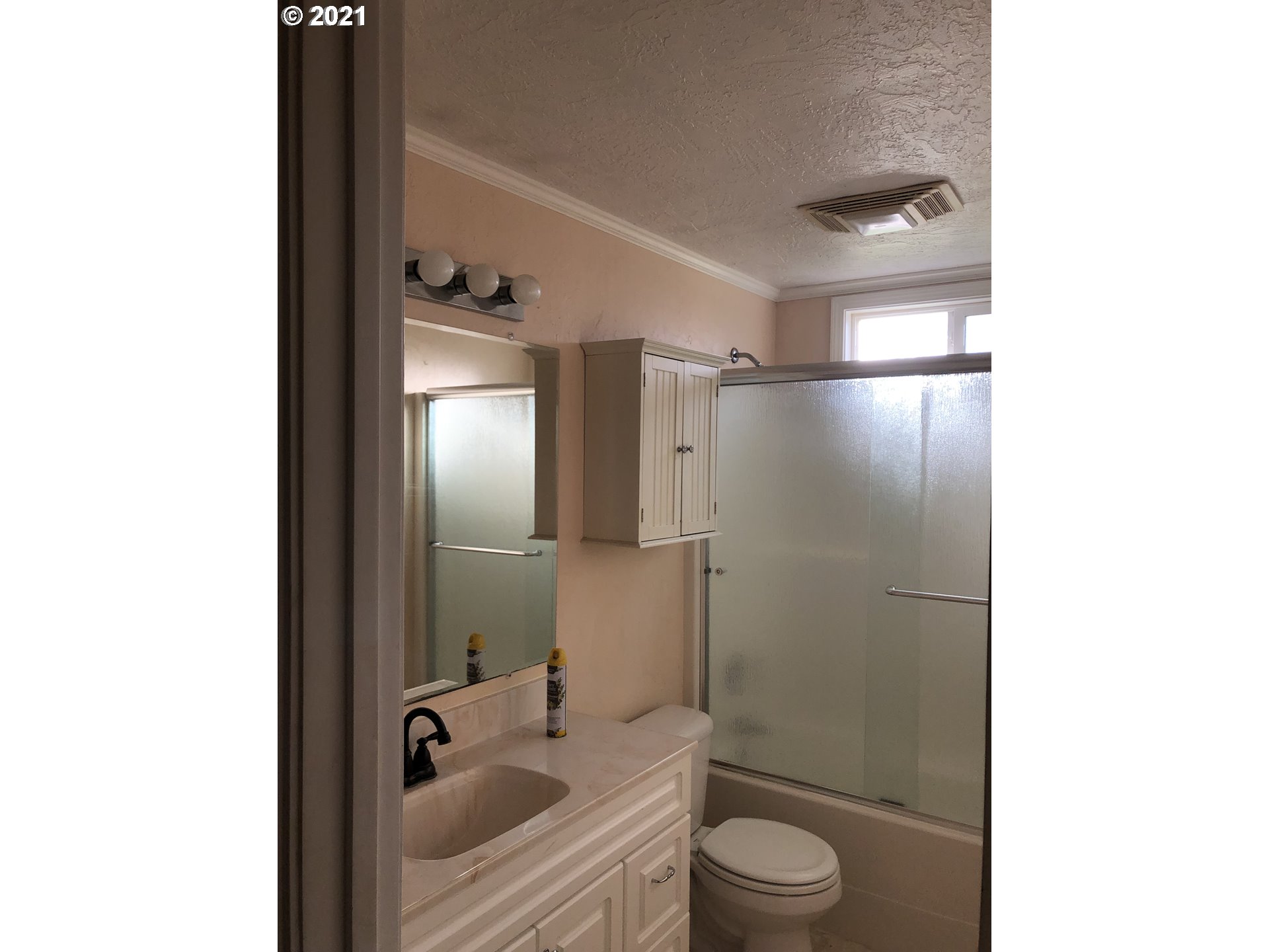 415 38th Street Springfield, OR 97478 - Photo 7 of 17 a bathroom with a granite countertop sink toilet and shower