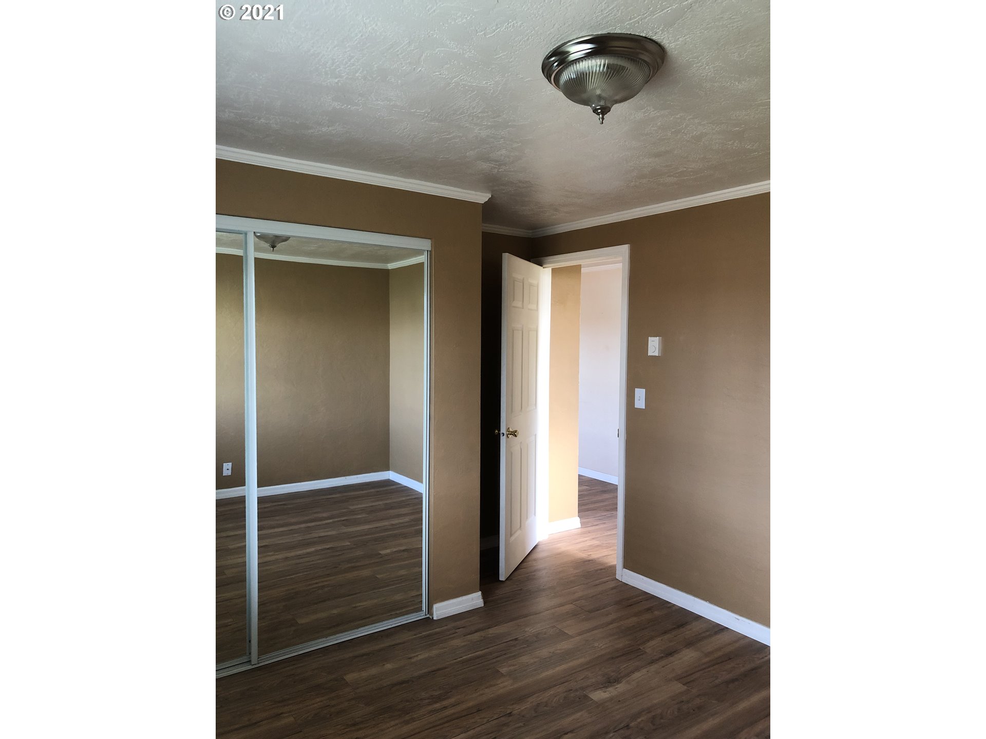 415 38th Street Springfield, OR 97478 - Photo 8 of 17 a view of a room with wooden floor