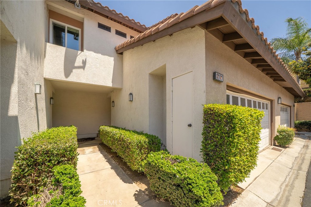 3707 Calle Curacso Riverside, CA 92503 - Photo 7 of 43 a front view of a house with garden