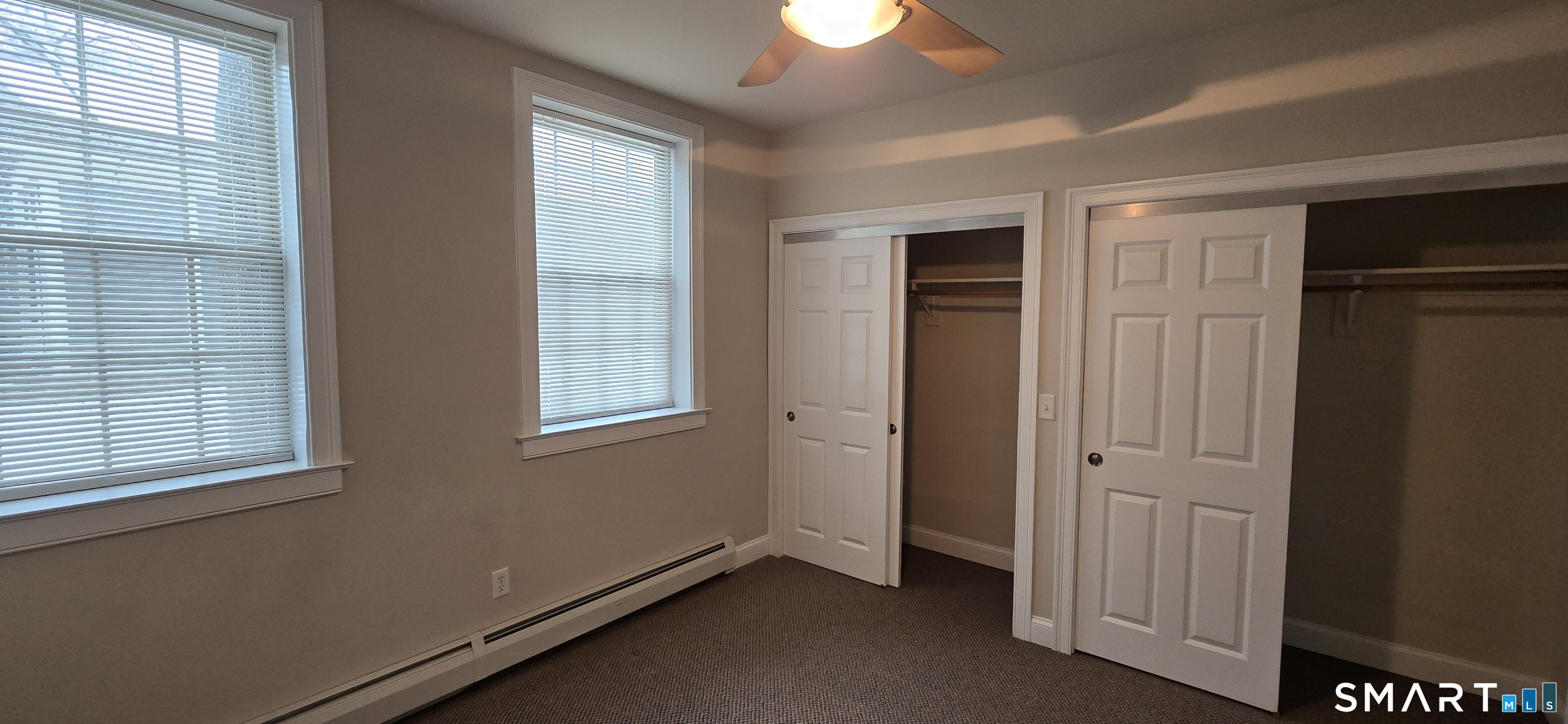 154 Washington Street, Unit 12A Norwich, CT 06360 - Photo 5 of 6 an empty room with windows