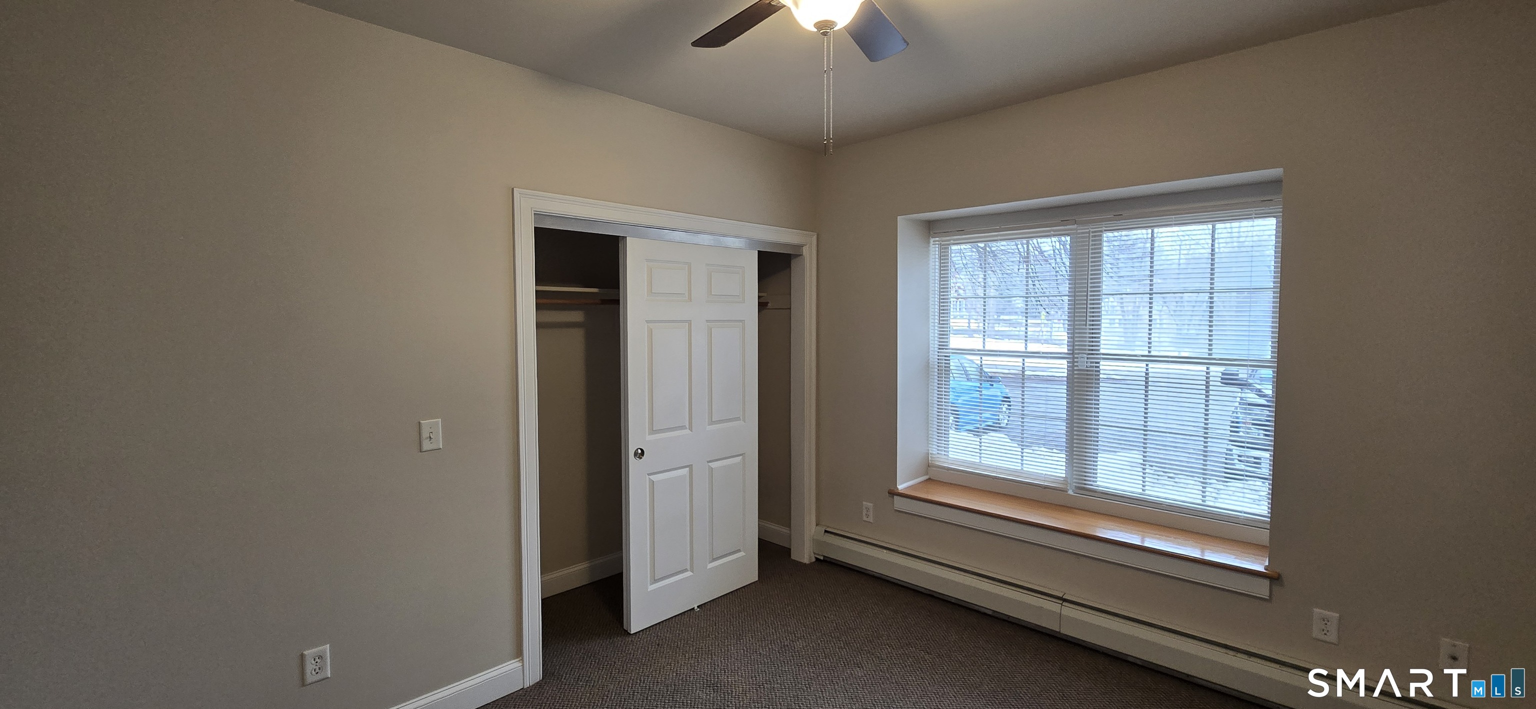154 Washington Street, Unit 12A Norwich, CT 06360 - Photo 6 of 6 wooden floor and window in an empty room
