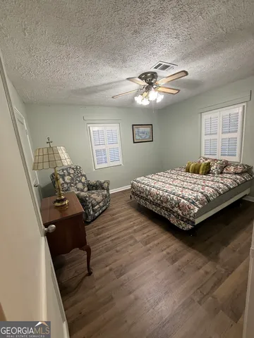 a bedroom with bed and window
