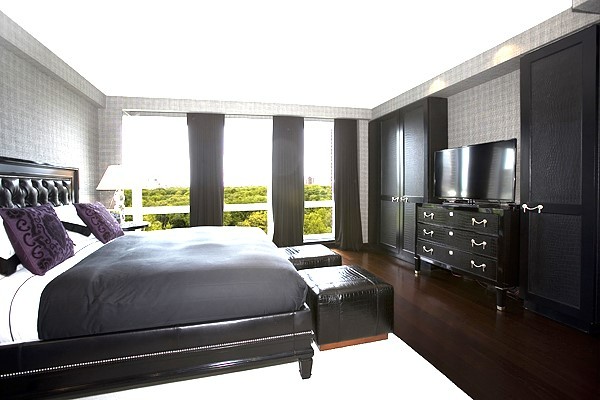 160 Central Park South, Unit 1005 Manhattan, NY 10019 - Photo 5 of 21 a bedroom with a bed a mirror and a large window