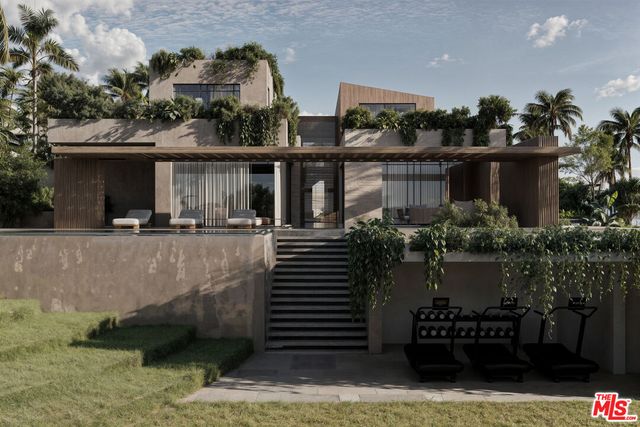 a front view of a house with a garden