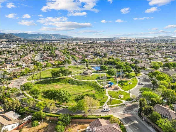 an aerial view of a house with a yard and lake view
