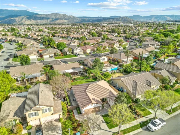 an aerial view of residential houses with outdoor space