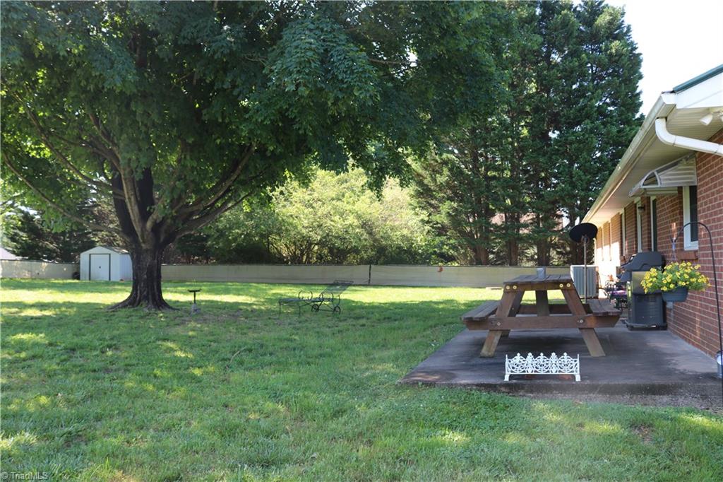 5133 Yukon Road Walkertown, NC 27051 - Photo 20 of 20 Nice back patio with a beautiful shade tree.