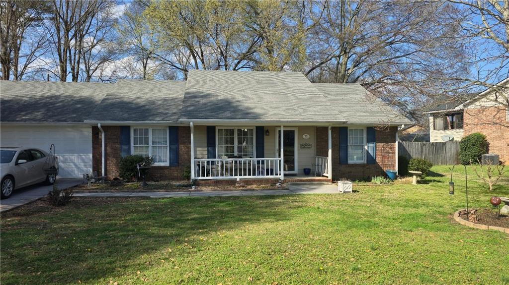 73 Cotton Bend Cartersville, GA 30120 - Photo 1 of 9 a backyard of a house with yard and outdoor seating