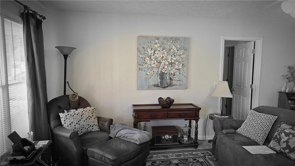 73 Cotton Bend Cartersville, GA 30120 - Photo 2 of 9 a living room with furniture and a window