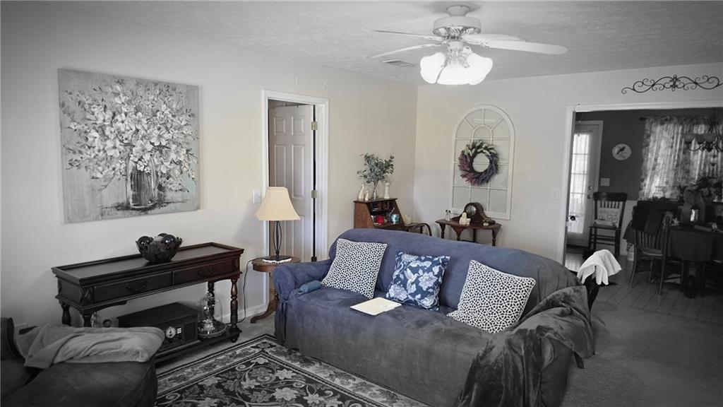 73 Cotton Bend Cartersville, GA 30120 - Photo 3 of 9 a living room with furniture and a mirror