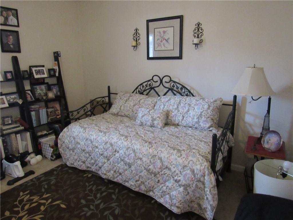 73 Cotton Bend Cartersville, GA 30120 - Photo 8 of 9 a bedroom with a bed and wooden floor
