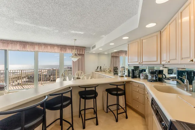 a kitchen with a table chairs stove and cabinets