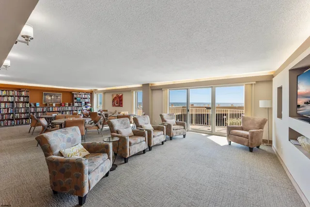a view of a dining room with furniture and window
