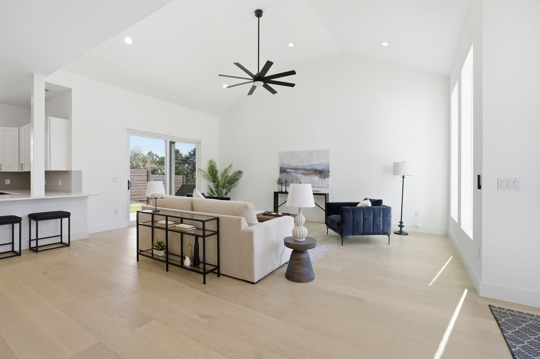 400 Post Rd Drive Austin, TX 78704 - Photo 6 of 23 Living room featuring light wood-style flooring, ceiling fan, recessed lighting, and lofted ceiling