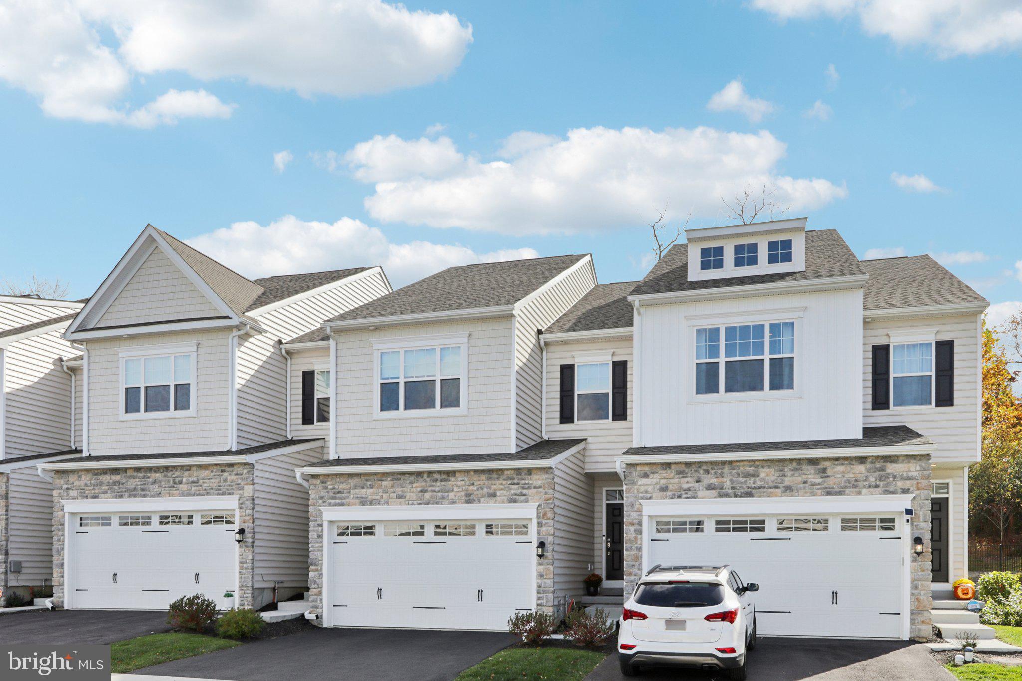 a view of building with car parked