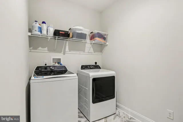 a view of a hallway with a livingroom and a way to rooms