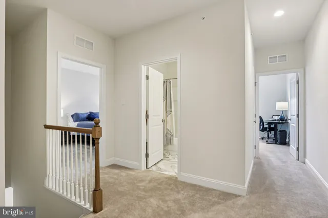 a view of a room with wooden shelves