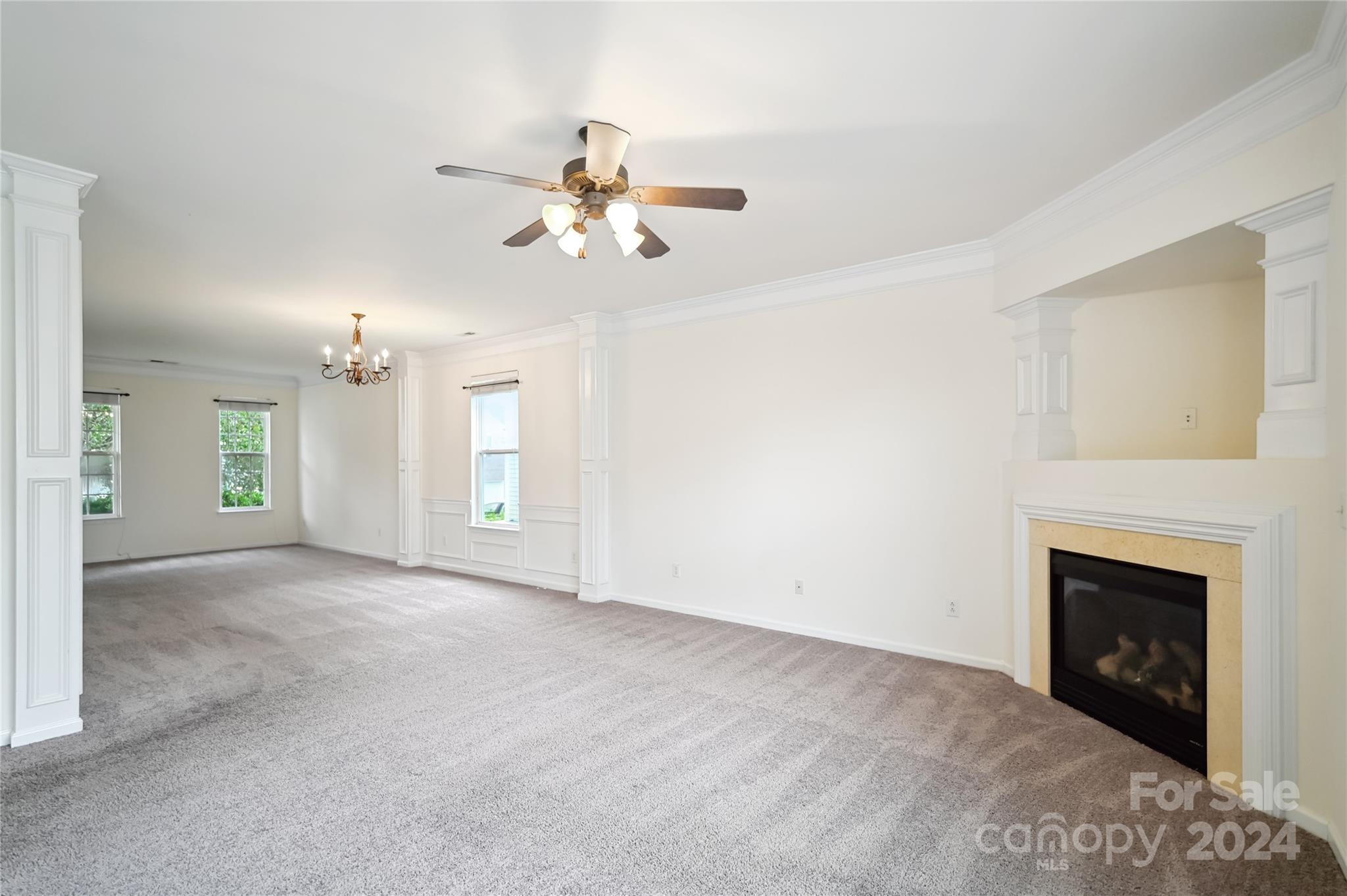 613 Latimer Way Monroe, NC 28110 - Photo 18 of 38 a view of empty room with fan and fireplace