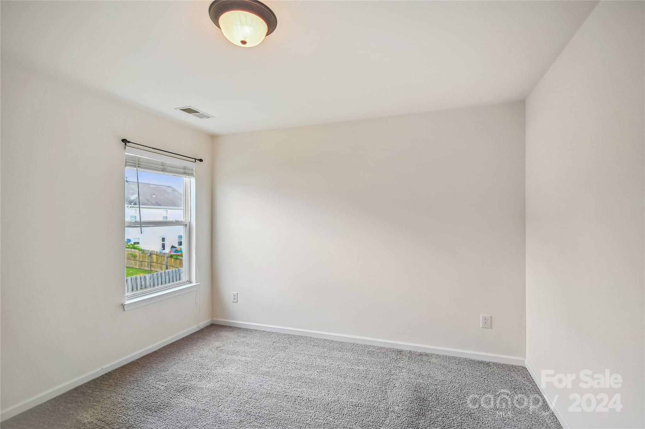 613 Latimer Way Monroe, NC 28110 - Photo 26 of 38 an empty room with windows