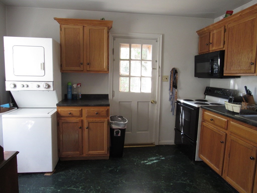 48 Burma Road Athol, MA 01331 - Photo 4 of 11 a kitchen with stainless steel appliances granite countertop a stove a sink dishwasher and a microwave oven with cabinets