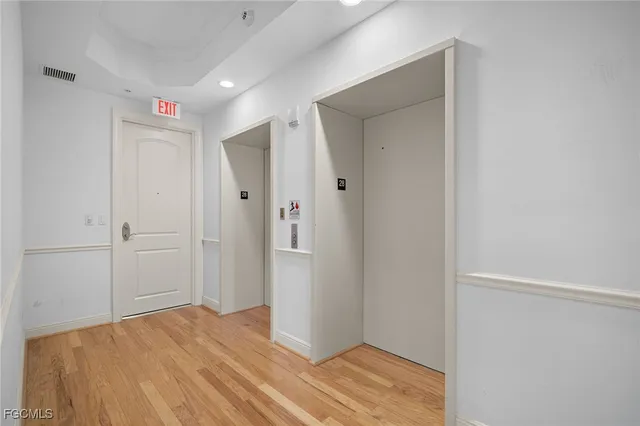 a view of an empty room and a bathroom