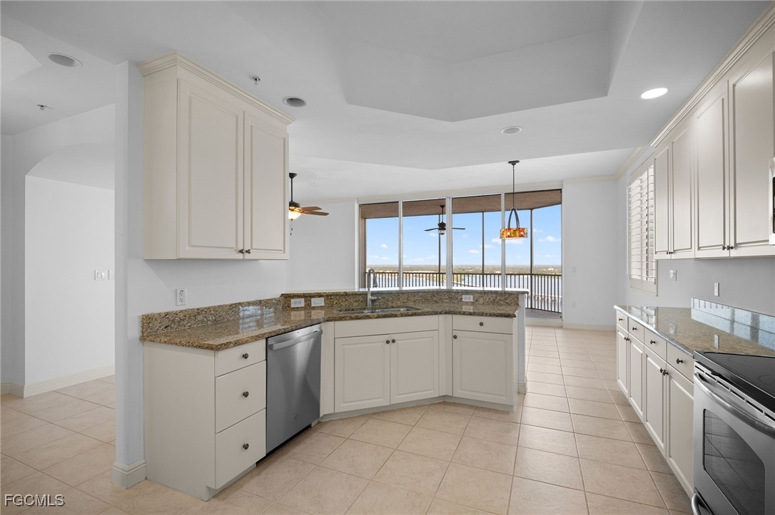 2090 West First Street, Unit F2806 Fort Myers, FL 33901 - Photo 20 of 34 a kitchen with a sink stove and cabinets