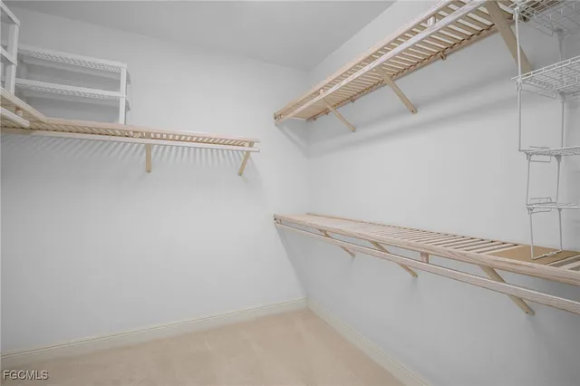 a large white bathroom with a large tub sink vanity and dryer