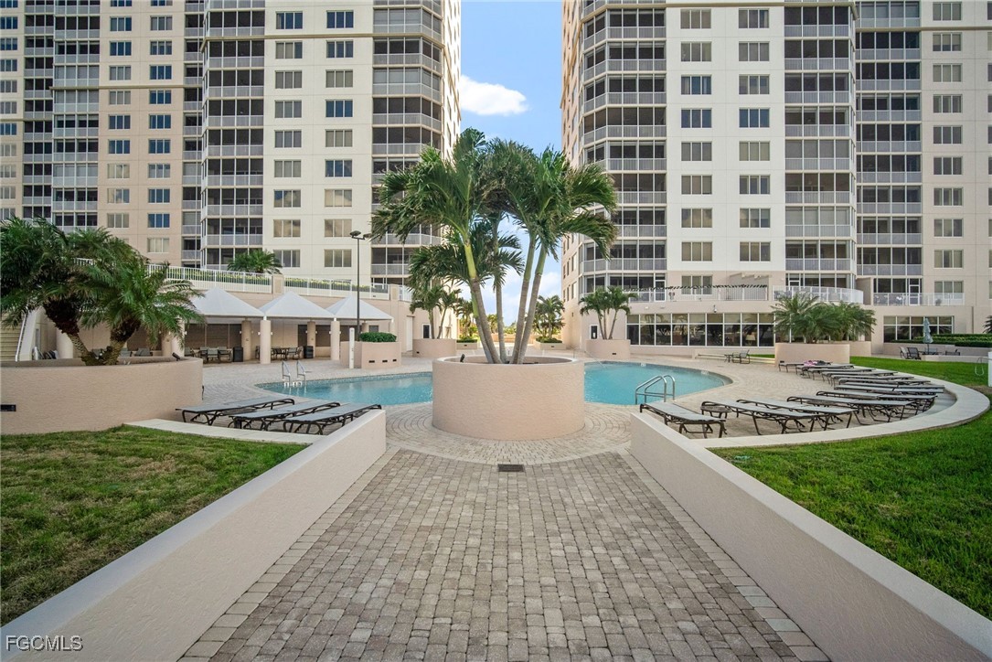 2090 West First Street, Unit F2806 Fort Myers, FL 33901 - Photo 28 of 34 a view of a building with garden and plants