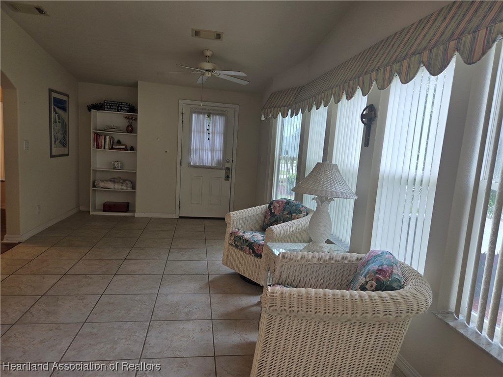 3312 Beartooth Pass Sebring, FL 33872 - Photo 11 of 39 a living room with furniture and a window