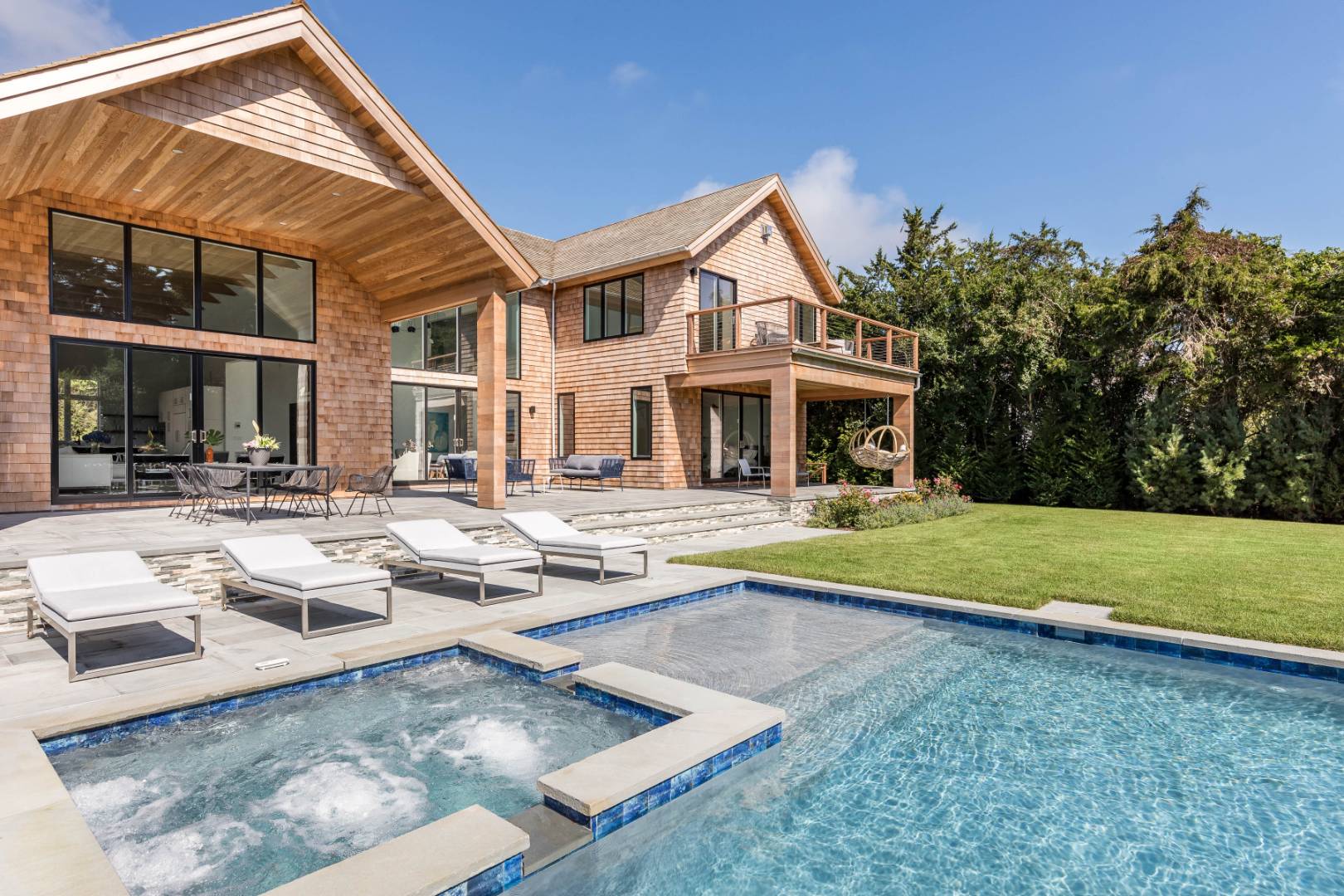 370 Pantigo Road East Hampton, NY 11937 - Photo 2 of 33 a view of a house with swimming pool and a yard