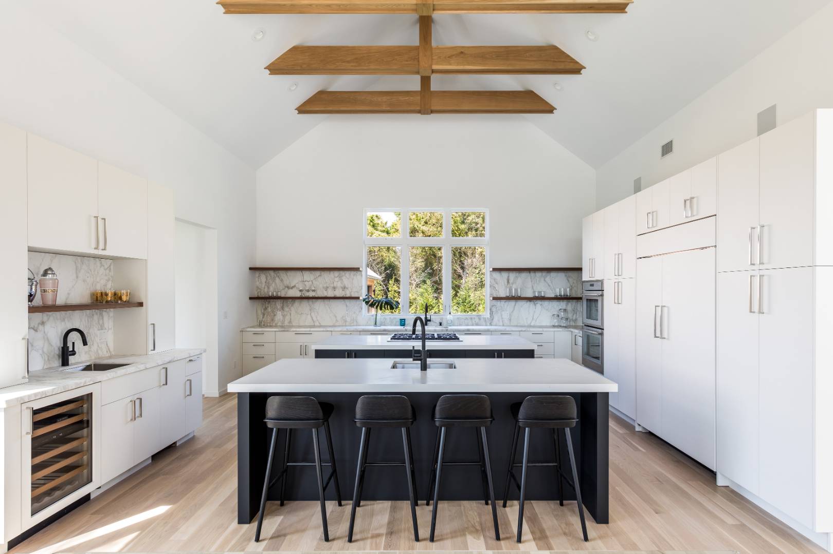 370 Pantigo Road East Hampton, NY 11937 - Photo 11 of 33 a kitchen with a sink cabinets and white stainless steel appliances