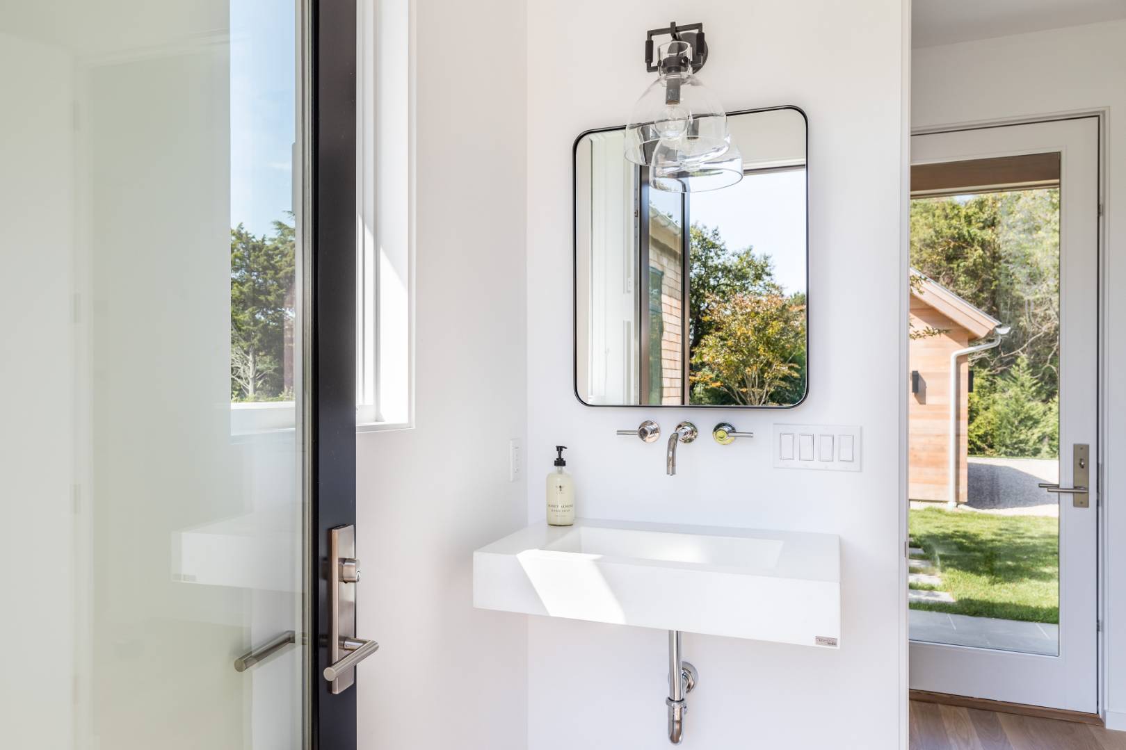 370 Pantigo Road East Hampton, NY 11937 - Photo 28 of 33 a bathroom with a sink and a mirror