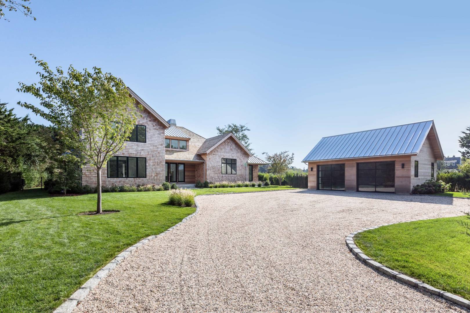 370 Pantigo Road East Hampton, NY 11937 - Photo 4 of 33 a front view of house with yard and green space