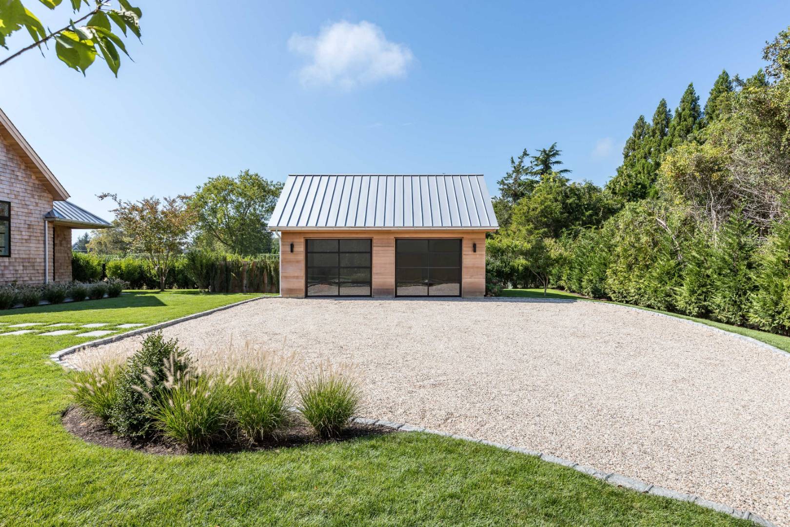 370 Pantigo Road East Hampton, NY 11937 - Photo 31 of 33 a view of a house with backyard and a garden