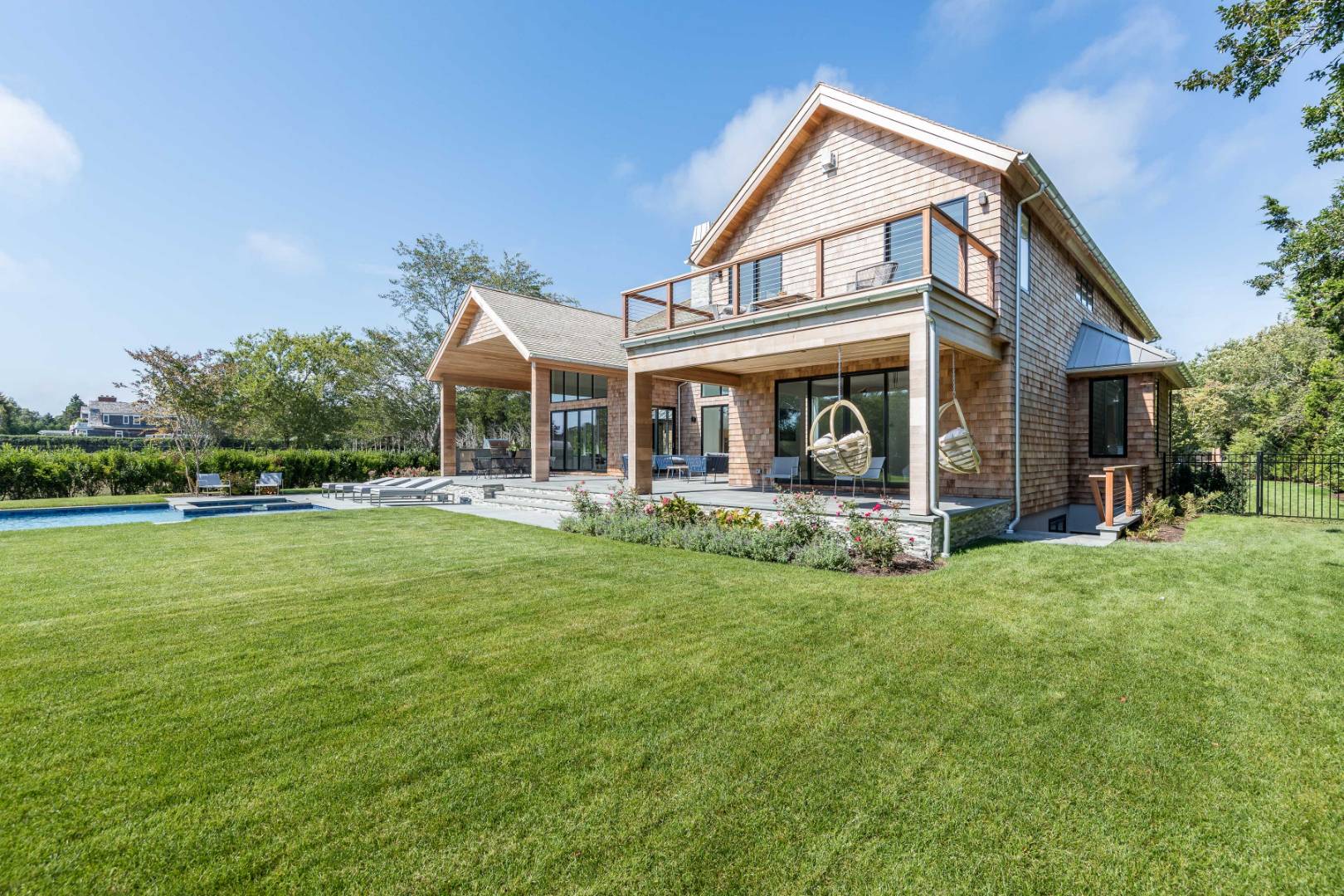 370 Pantigo Road East Hampton, NY 11937 - Photo 32 of 33 a front view of a house with garden