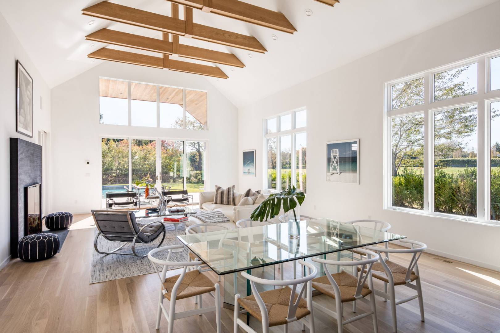 370 Pantigo Road East Hampton, NY 11937 - Photo 7 of 33 a view of a dining room with furniture large windows and wooden floor