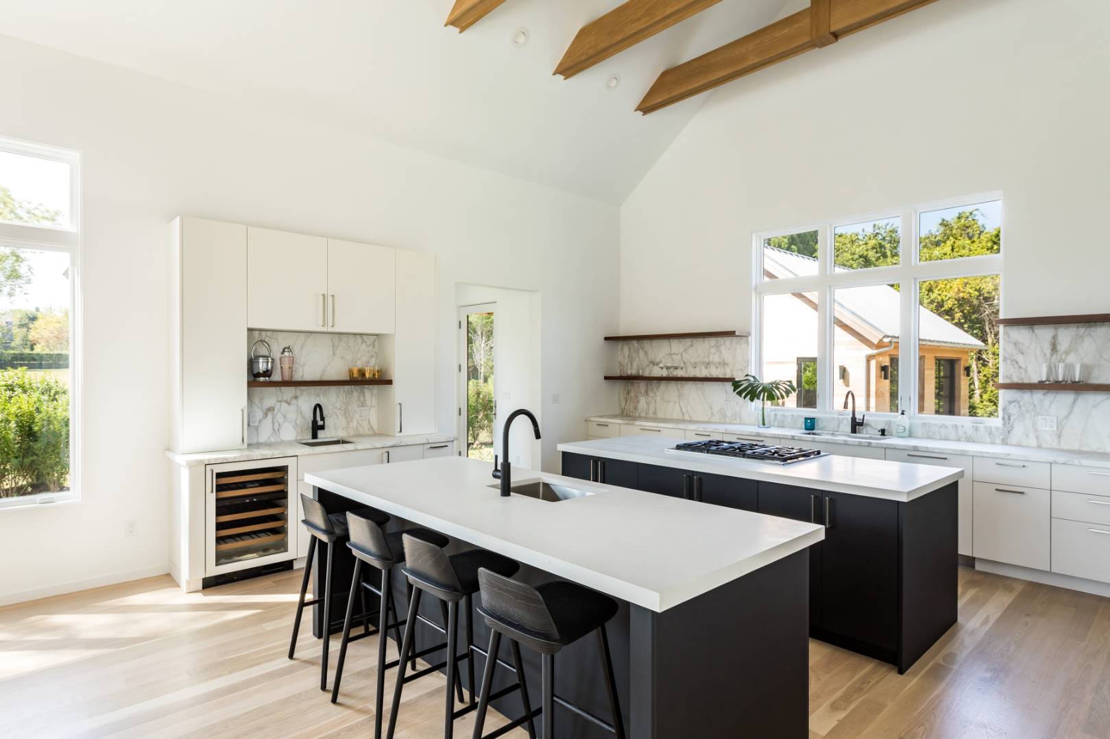 370 Pantigo Road East Hampton, NY 11937 - Photo 10 of 33 a kitchen with a table chairs stove and cabinets