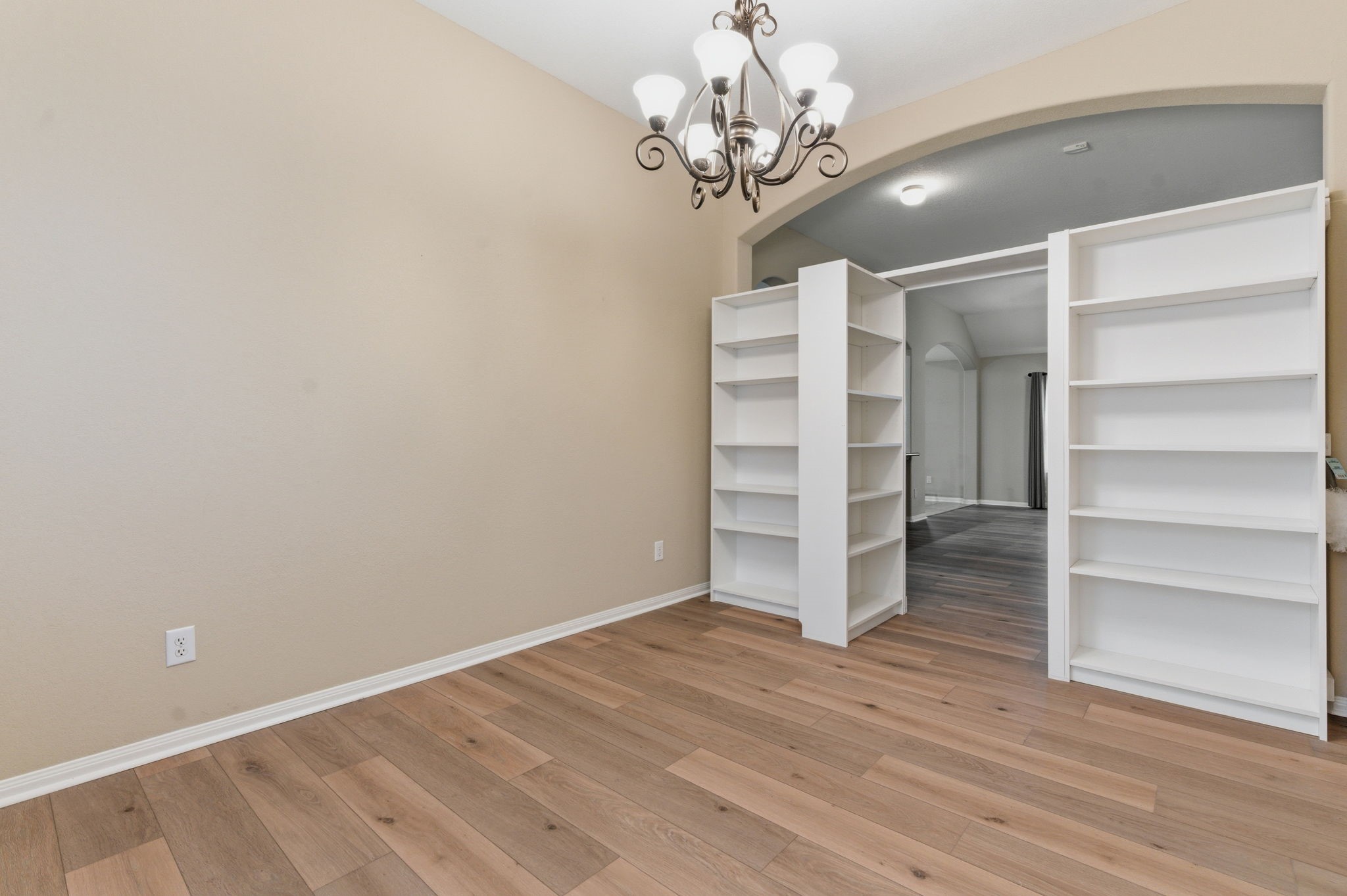 21822 Mount Hunt Drive Spring, TX 77388 - Photo 8 of 26 Elegant office entry with built-in shelving and stylish lighting, providing a welcoming and functional space.