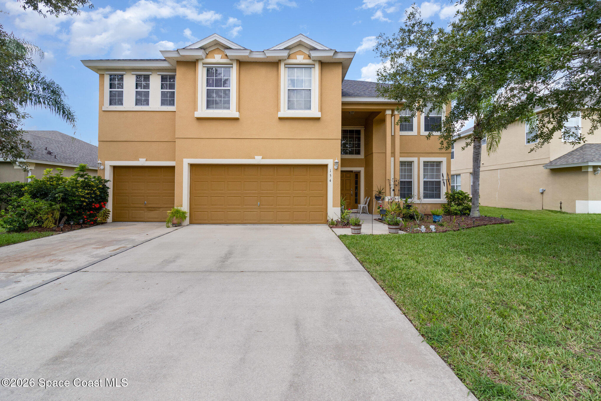 154 Wading Bird Circle Southwest Palm Bay, FL 32908 - Photo 1 of 45 a front view of house with yard