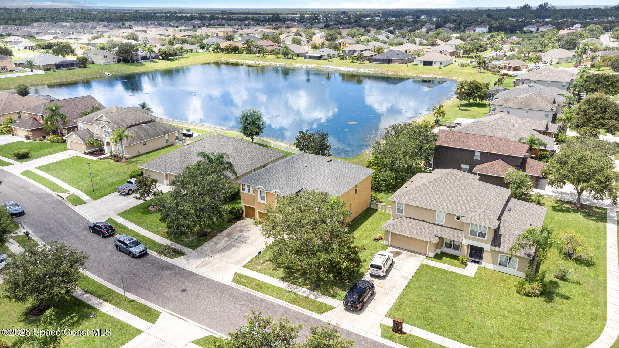 154 Wading Bird Circle Southwest Palm Bay, FL 32908 - Photo 11 of 45 an aerial view of a house with a lake view