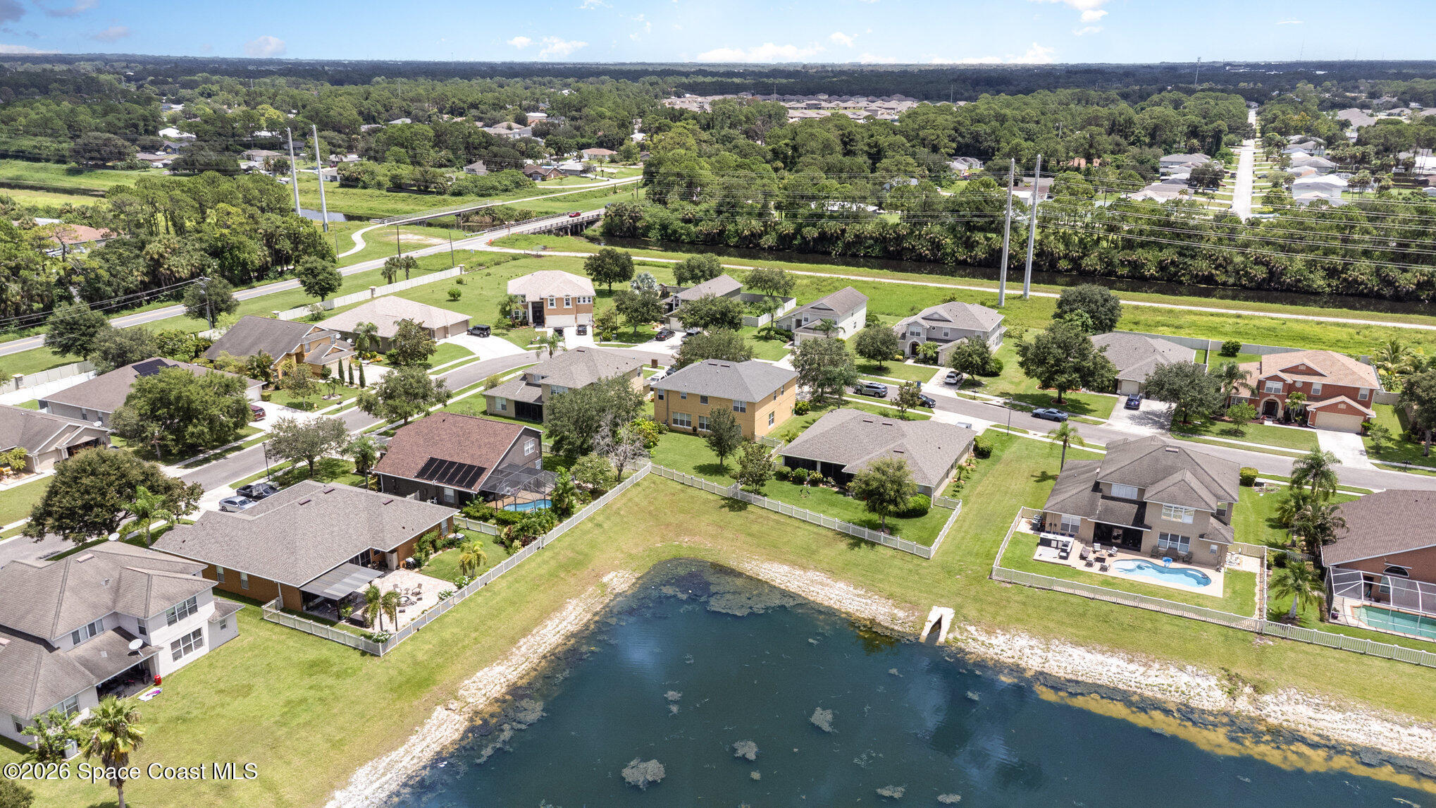 154 Wading Bird Circle Southwest Palm Bay, FL 32908 - Photo 12 of 45 an aerial view of a house with a garden