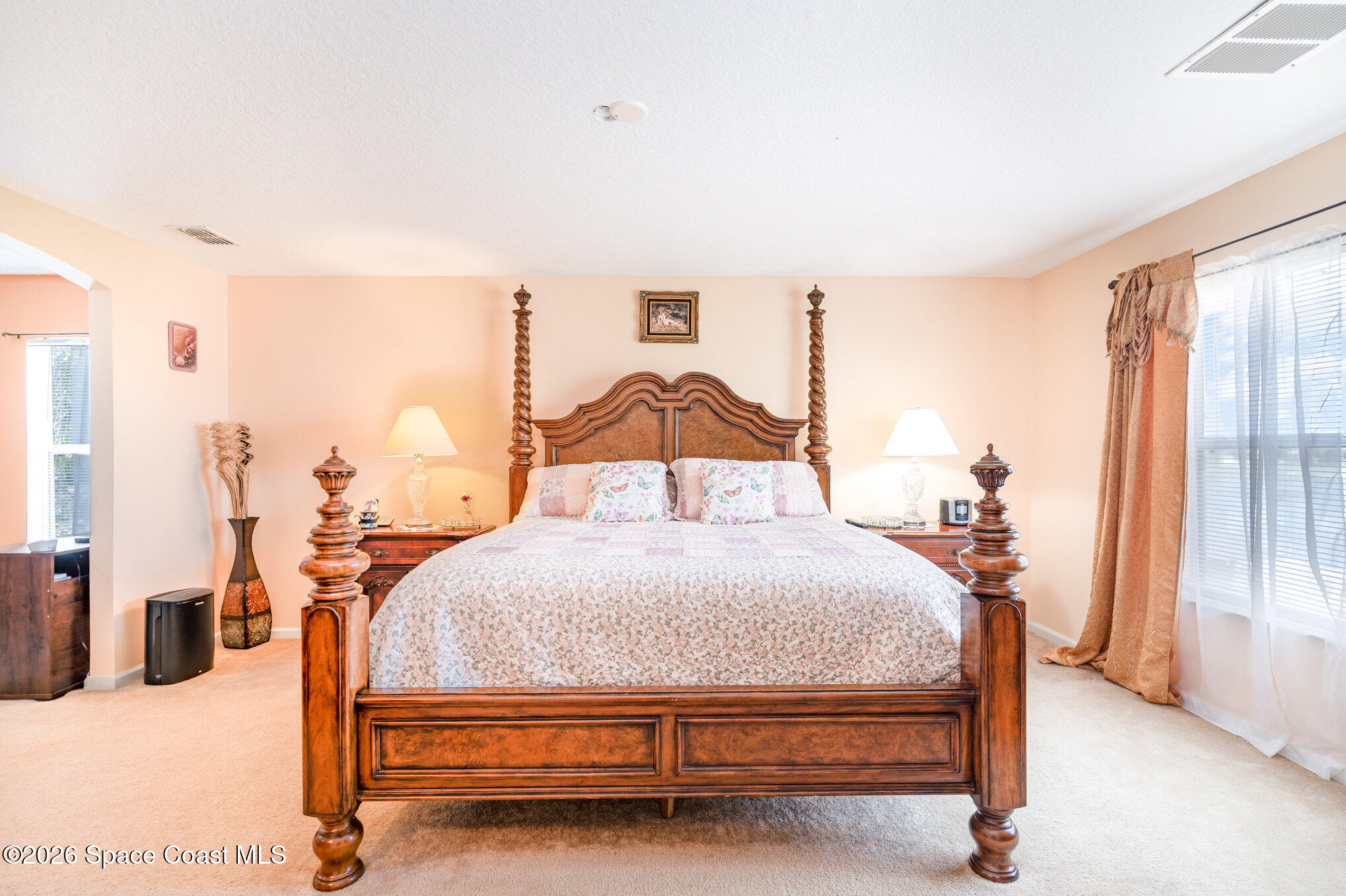 154 Wading Bird Circle Southwest Palm Bay, FL 32908 - Photo 15 of 45 a bedroom with a bed and window