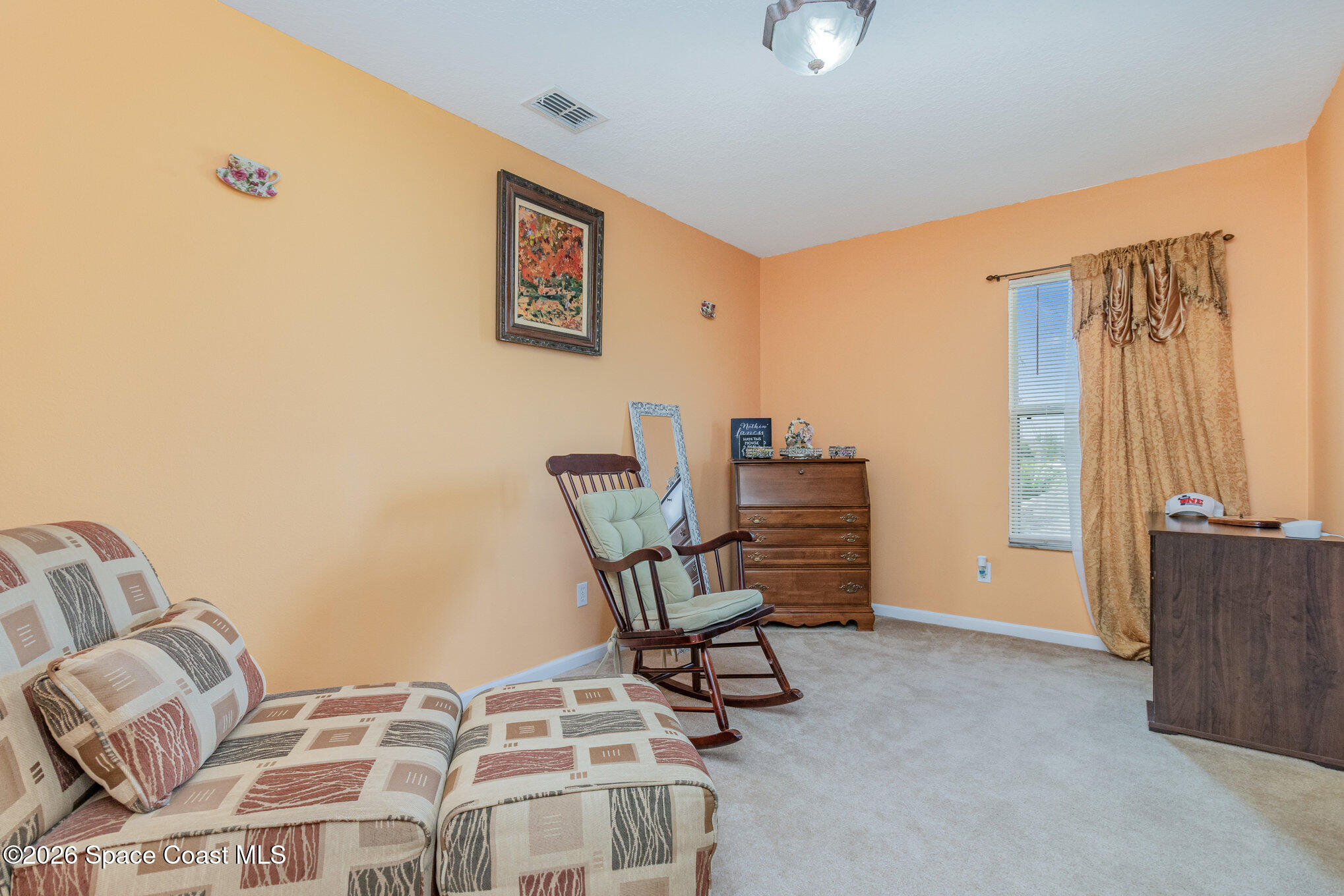 154 Wading Bird Circle Southwest Palm Bay, FL 32908 - Photo 35 of 45 a view of a livingroom with lounge chair and couch