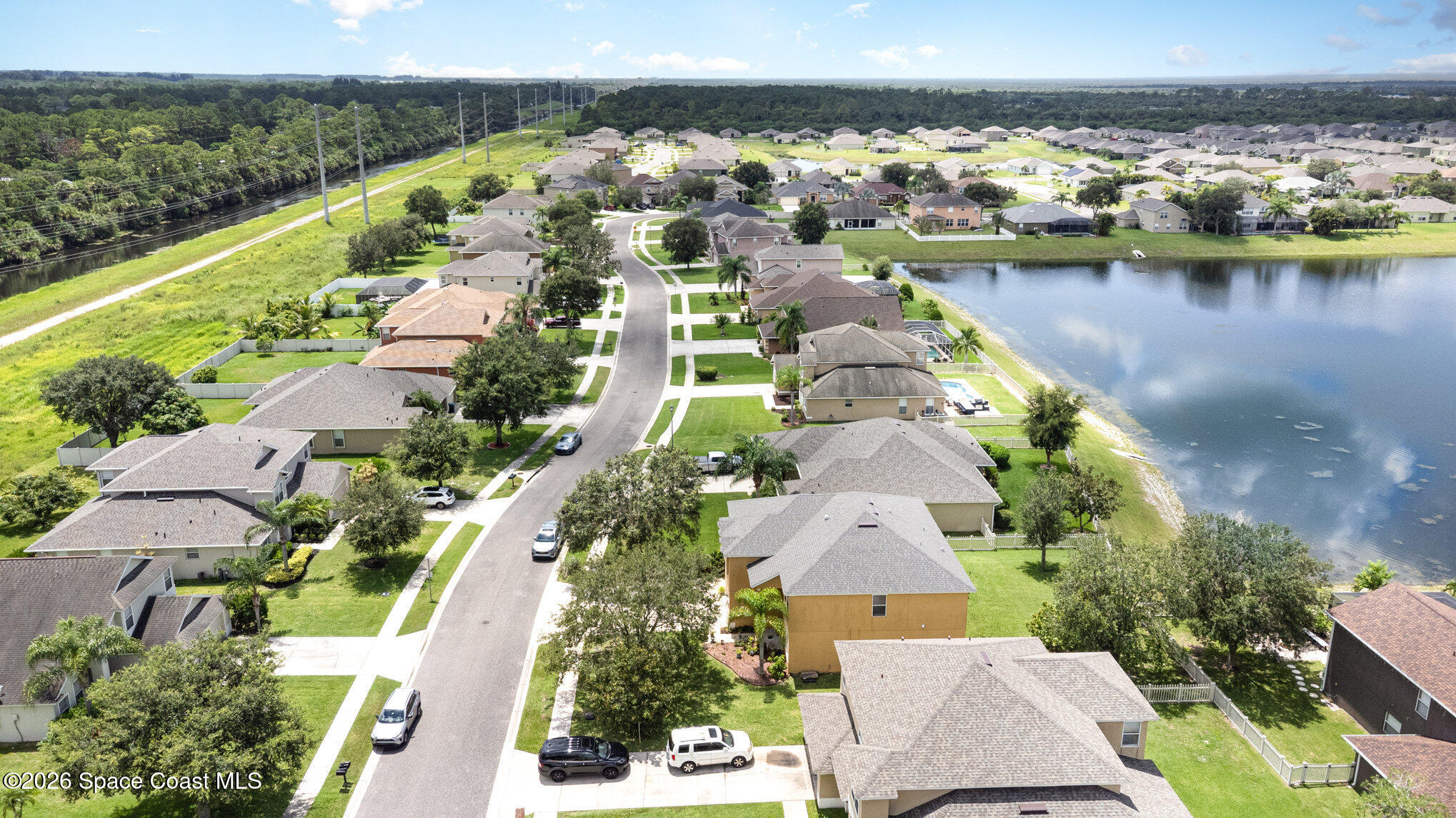 154 Wading Bird Circle Southwest Palm Bay, FL 32908 - Photo 43 of 45 an aerial view of residential houses with outdoor space