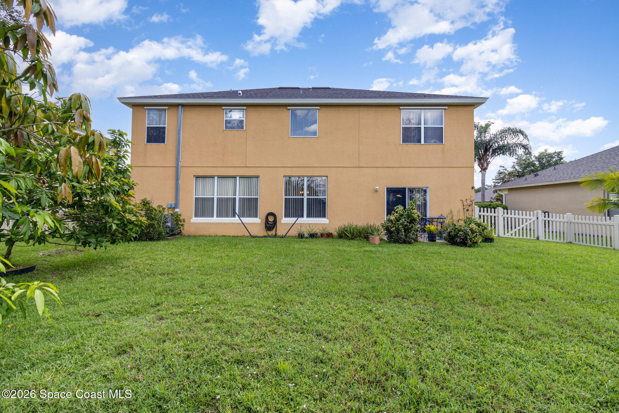 154 Wading Bird Circle Southwest Palm Bay, FL 32908 - Photo 45 of 45 a view of a house with backyard and garden