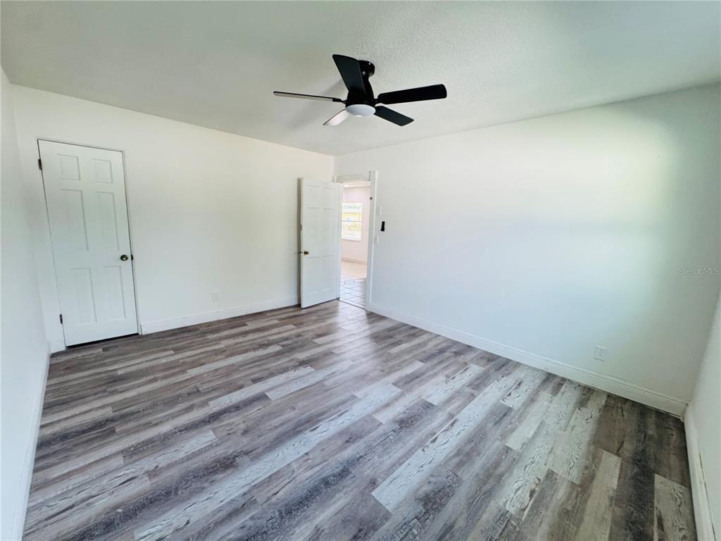 209 East Main Street Dundee, FL 33838 - Photo 7 of 13 a view of empty room with wooden floor