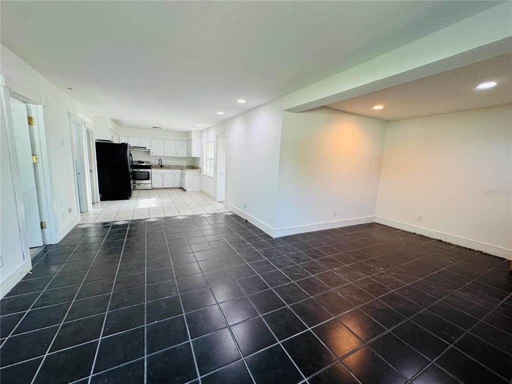 209 East Main Street Dundee, FL 33838 - Photo 10 of 13 a bathroom with a sink and a washing machine