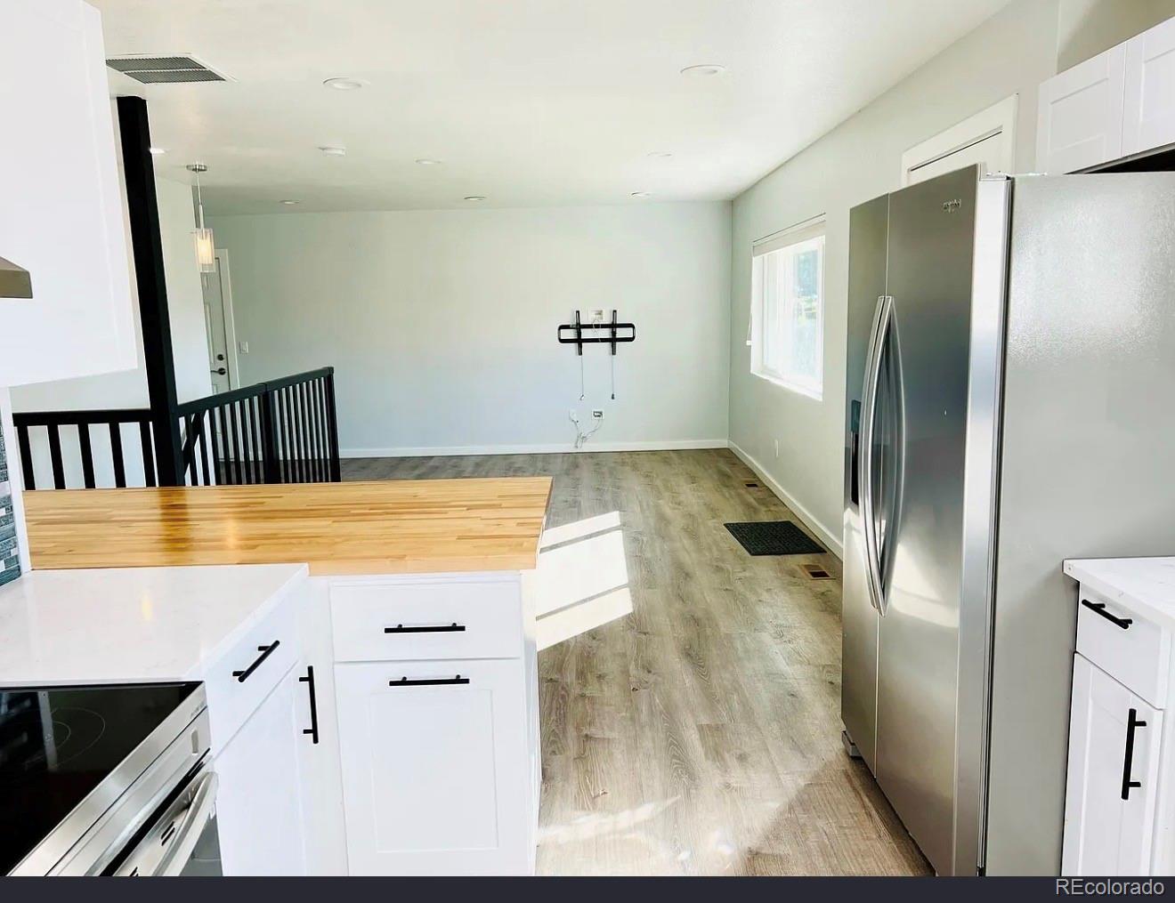 3146 Milwaukee Street Denver, CO 80205 - Photo 4 of 14 a view of a kitchen from the hallway