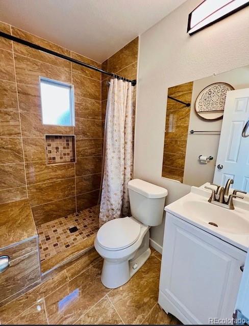 3146 Milwaukee Street Denver, CO 80205 - Photo 6 of 14 a bathroom with a sink toilet and shower